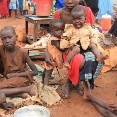 Christine Elia, 27, holds her twin sons at a displaced persons camp protected by U.N. peacekeepers in Wau, South Sudan, September 4, 2016. 2016. 