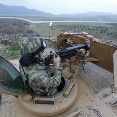 A Turkish soldier surveys the border line between Turkey and Syria near the city of Kilis, March 2, 2017. 
