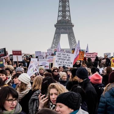 Demonstrators carrying banners and placards take part in the Women's March next to the Eiffel Tower on the Parvis des Droits de l'Homme on January 21, 2017 in Paris, France. 