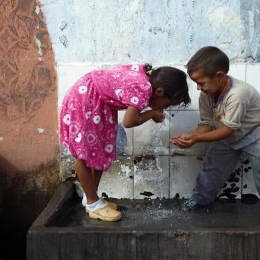Roma refugees from Kosovo drink water at the Vrela Ribnicka camp in Podgorica, Montenegro on October 13, 2012