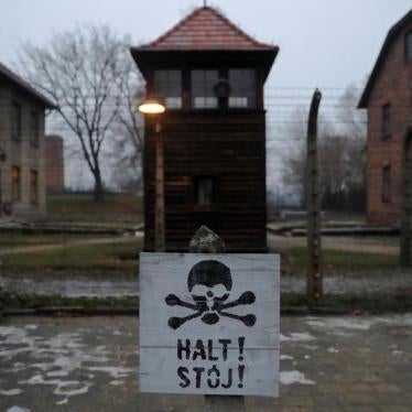A sign reading "Stop!" in German and Polish is seen at the former Nazi German concentration and extermination camp Auschwitz, during the ceremonies marking the 73rd anniversary of the liberation of the camp and International Holocaust Victims Remembrance 