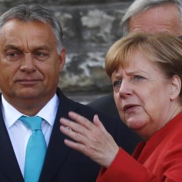 Germany's Chancellor Angela Merkel talks with Hungary's Prime Minister Viktor Orban before a photo at the European Union Tallinn Digital Summit in Tallinn, Estonia, September 29, 2017. 