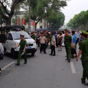 Police disperse a demonstration against a draft law on special economic zones in Hanoi, Vietnam, June 10, 2018. 