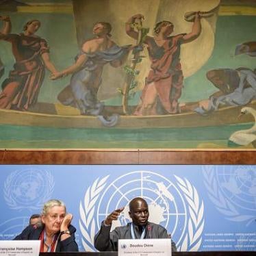 Member of the UN Commission of Inquiry on Burundi, Françoise Hampson (L), and chairman Doudou Diène (C), give a press conference to present a report on rights violations in the country on September 5, 2018 in Geneva. 