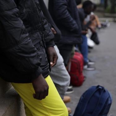 Unaccompanied teens queue outside the Paris evaluation facility 