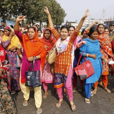 Bangladeshi garment workers shout slogans during a protest in Savar, on the outskirts of Dhaka, Bangladesh, Wednesday, Jan. 9, 2019. Thousands