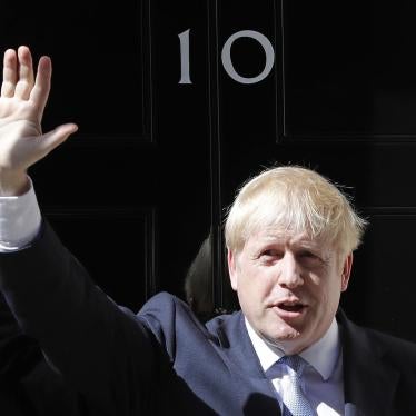 Britain's new Prime Minister Boris Johnson waves from the steps outside 10 Downing Street, London, on Wednesday, July 24, 2019.
