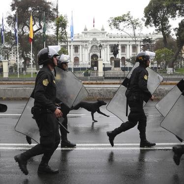 Riot police walk in front of the closed congress building in Lima, Peru, Tuesday, Oct. 1, 2019. 