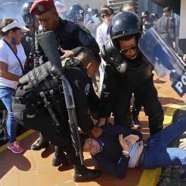 An anti-government protester is dragged away and arrested by police as security forces disrupt an opposition march coined "United for Freedom" in Managua, Nicaragua, Sunday, Oct. 14, 2018.