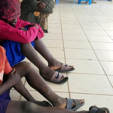 Street children sit on the verandah of a house in Kigali, Rwanda’s capital city, on January 22, 2020.