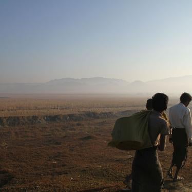 Three people walk along a road close to the surge of fighting between the Arakan Army and Myanmar military in Rakhine State, January 25, 2019.