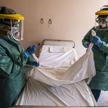 Nurses in protective gear prepare a ward designated for new patients infected with Covid-19 in a hospital in Budapest, Hungary, March 16, 2020.