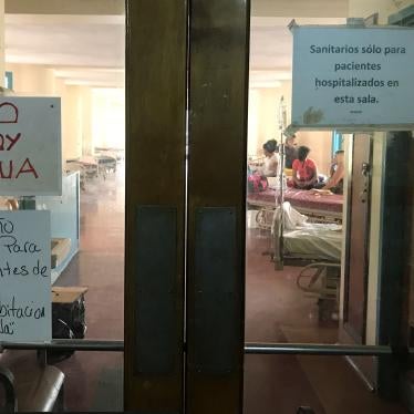 A sign that reads "There is no water" (top L) is seen at the Central University of Venezuela (UCV) hospital in Caracas, Venezuela. 