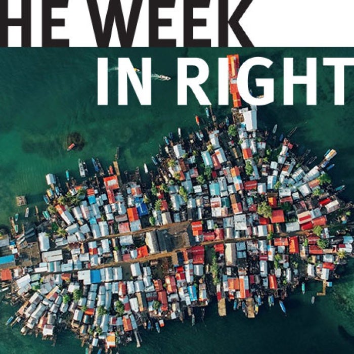 Collection of houses on small island. 