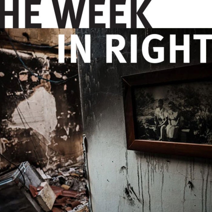 A family photo hangs on the wall inside a burned-out house in Kibbutz Be'eri in the aftermath of the October 7, 2023 assault by Palestinian armed groups on southern Israel