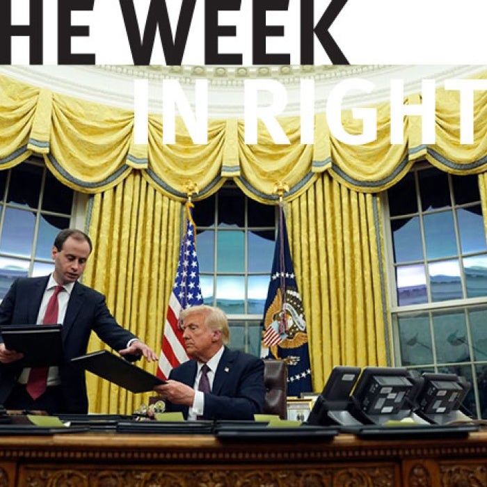 Donald Trump shakes hands in the White House.